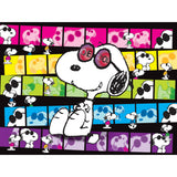 An illustration of Snoopy, wearing sunglasses labeled "JOE COOL," is centered. Background features a collage of colorful panels with various Snoopy poses. RoseArt - PEANUTS - Joe Cool - 300 Piece Jigsaw Puzzle.