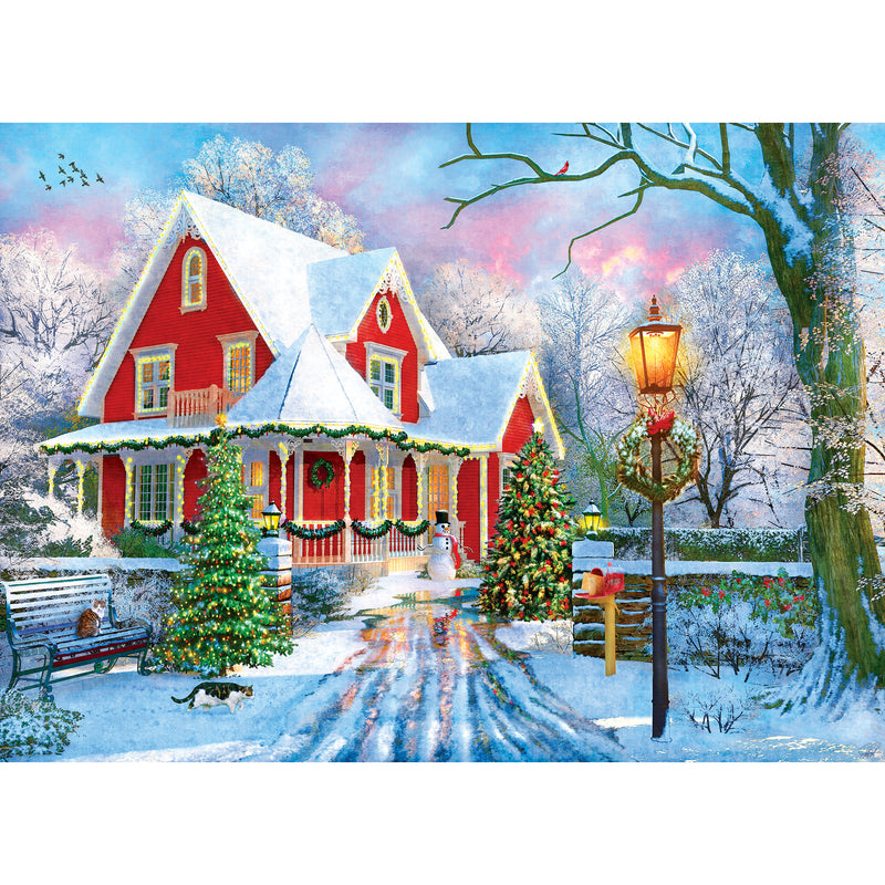 Colorful illustration of a red house decorated for Christmas, surrounded by snow-covered trees and a snow-covered yard, with a lit lamppost, a decorated Christmas tree, and snowman in the center – RoseArt - Kodak Premium - Christmas at Home - 1000 Piece Jigsaw Puzzle.