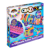 A Cra-Z-Loom Ultimate Rubber Band Loom kit for making rubber band bracelets is shown. The box displays images of colorful bracelets, a loom, and the text: “The Ultimate Rubber Band Loom! Includes 600 rubber bands.”