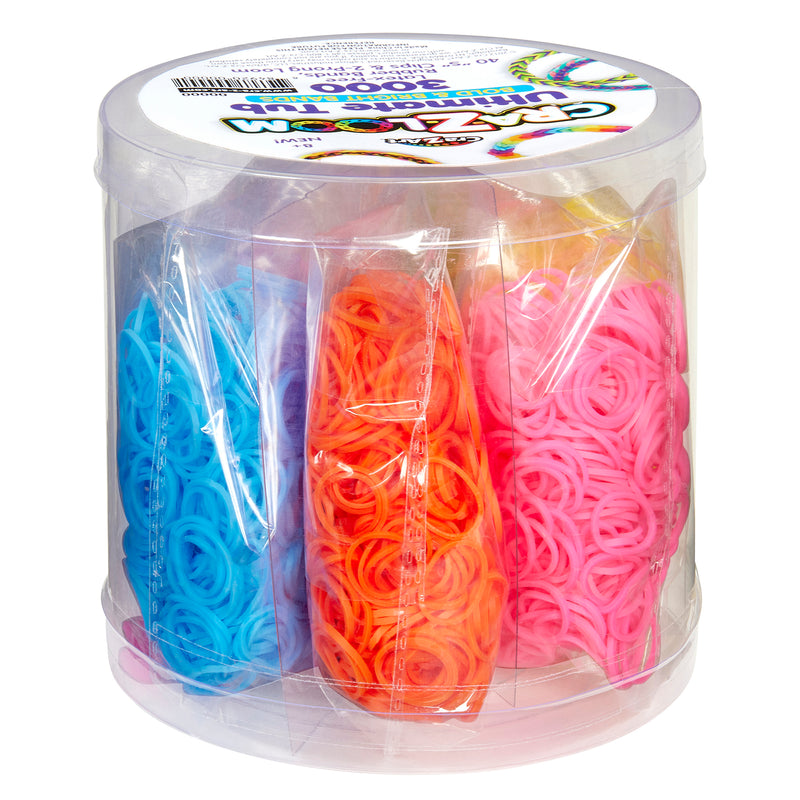 A clear cylindrical container holding multiple packs of colorful rubber bands, including blue, orange, and pink bands. The label on top says "Cra-Z-Loom Ultimate Rubber Band Loom".