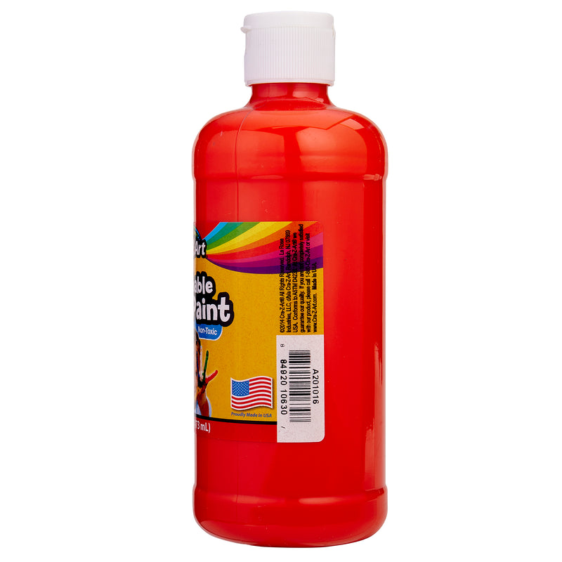 A tall plastic bottle filled with red liquid, featuring a white cap and a rainbow-colored label with text and a barcode. An American flag is on the bottom left of the label. Cra-Z-Art Orange Paint 16 oz - Bold, Vibrant, and Easy to Apply for Creative Projects! Safe for Kids 3+