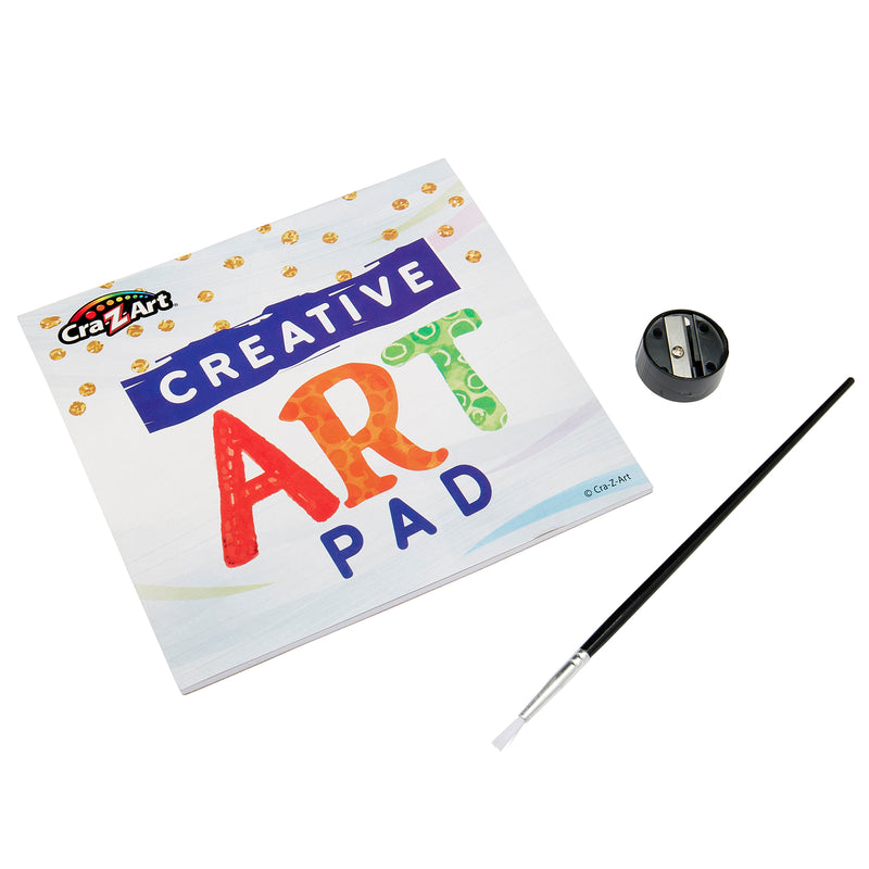 A Cra-Z-Art Creative Art Studio, 250 Piece mega art set! with a black paintbrush and a black pencil sharpener placed on a white surface.