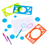 Three **Cra-Z-Art Spiral Art: Ultimate Spinning Design Kit with 3 Pens, Frames, and Wheels!,** a piece of paper with doodles, and three colored pens are arranged on a white surface.