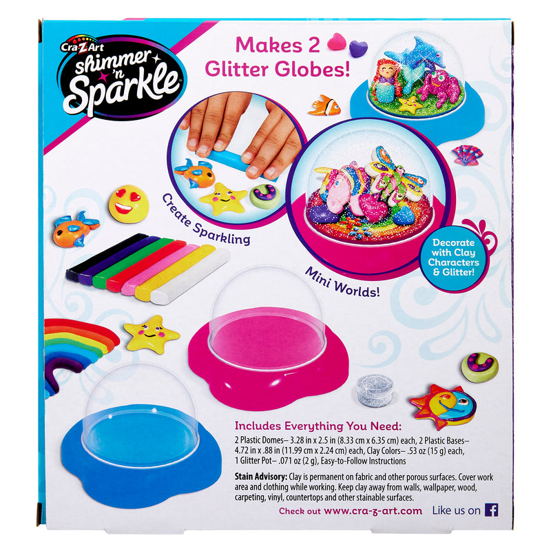 Packaging for "Shimmer 'n Sparkle Glitter Globes: Create Colorful 3D Keepsake Art with Glitter Magic!" kit, showing images of finished globes, colorful molds, and included materials: 2 domes, stands, clay sticks, glitter, and tools with instructions.