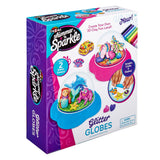 A children's craft kit box for "Shimmer 'n Sparkle Glitter Globes: Create Colorful 3D Keepsake Art with Glitter Magic!" with clay and decoration materials for creating colorful 3D globe scenes. Text on the box reads "Create Your Own 3D Clay Fun Land!" For ages 6 and up.