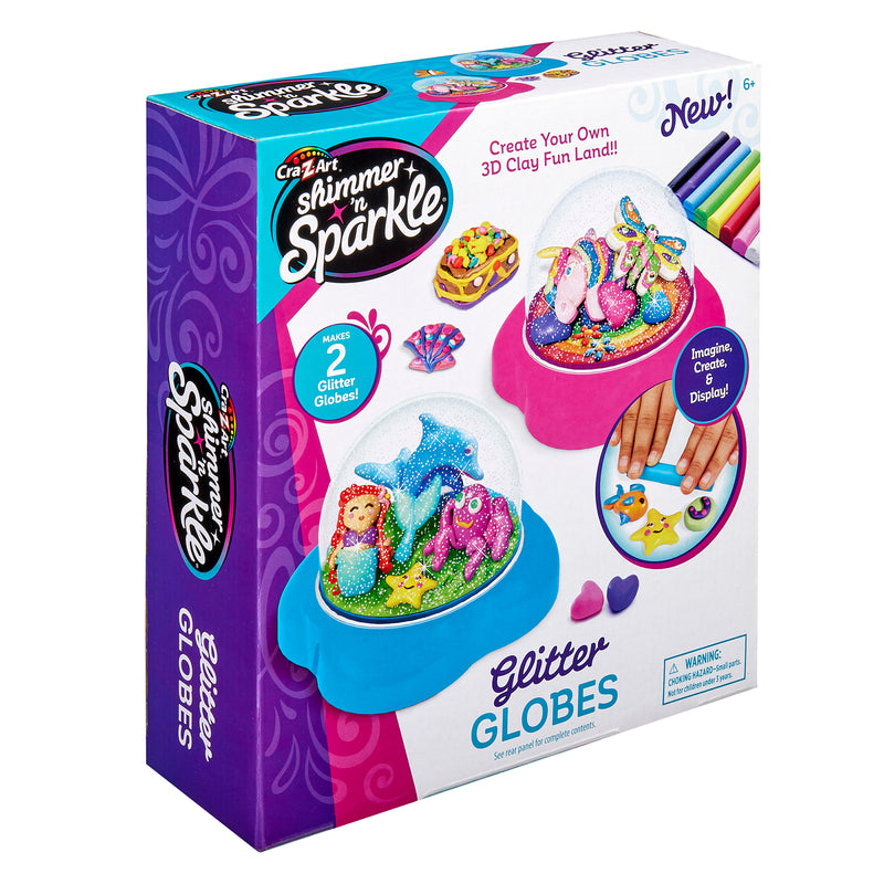 A children's craft kit box for "Shimmer 'n Sparkle Glitter Globes: Create Colorful 3D Keepsake Art with Glitter Magic!" with clay and decoration materials for creating colorful 3D globe scenes. Text on the box reads "Create Your Own 3D Clay Fun Land!" For ages 6 and up.