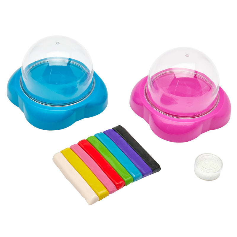 Two **Shimmer 'n Sparkle Glitter Globes: Create Colorful 3D Keepsake Art with Glitter Magic!** kits with dome-shaped containers—one blue, one pink—alongside eight colorful putty sticks and a small container of glitter.