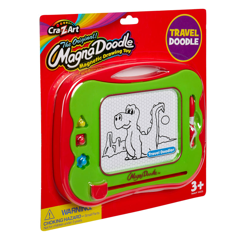 A Travel Magna Doodle in green packaging, featuring a dinosaur drawing on the screen. The toy is suitable for children aged 3 and up and includes a travel doodle version.