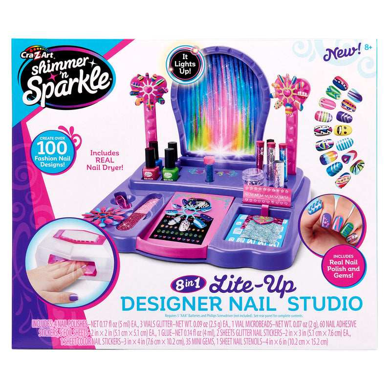Colorful toy packaging for a Shimmer 'n Sparkle 8 In 1 Lite-up Designer Nail Studio, includes nail polish, stickers, and a nail dryer. Promises over 100 fashion nail designs. For ages 8 and up.