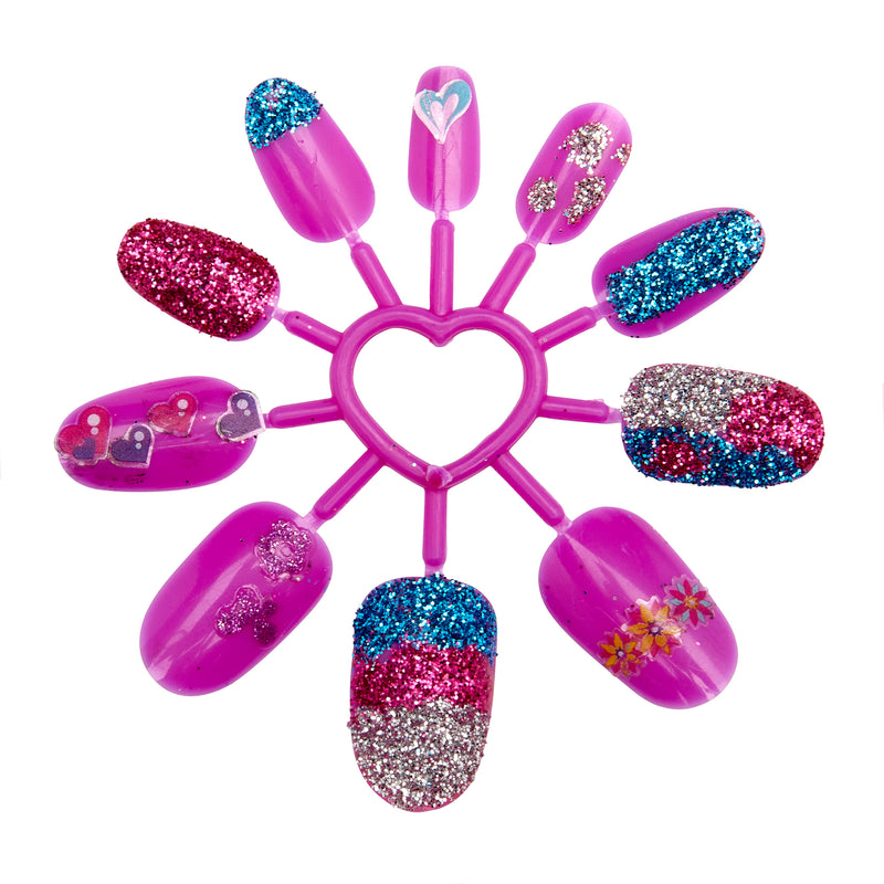 A circular Shimmer 'n Sparkle 8 In 1 Lite-up Designer Nail Studio featuring purple nails with various glitter and sticker designs arranged around a heart-shaped center.