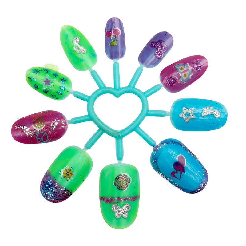 Display of colorful Shimmer 'n Sparkle 8 In 1 Lite-up Designer Nail Studio arranged in a circular pattern around a heart-shaped center. Each nail features different designs and glitter embellishments on various backgrounds.