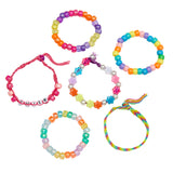Six colorful Shimmer 'n Sparkle 2 in 1 Spin & Bead Bracelet Studio bracelets in various patterns, including one with block letters spelling "SMILE.
