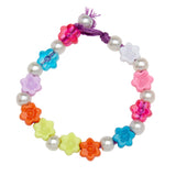 A Shimmer 'n Sparkle 2 in 1 Spin & Bead Bracelet Studio made of plastic flower-shaped beads and silver round beads, strung on a purple thread with a knot.