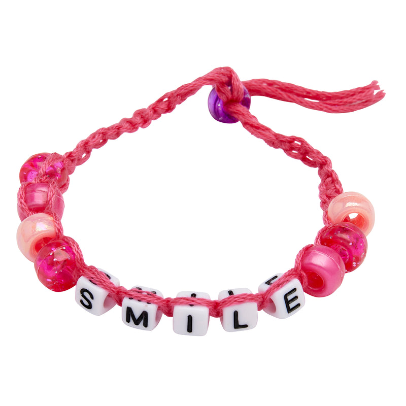 A Shimmer 'n Sparkle 2 in 1 Spin & Bead Bracelet Studio with pink and white beads, featuring letter beads spelling "SMILE.