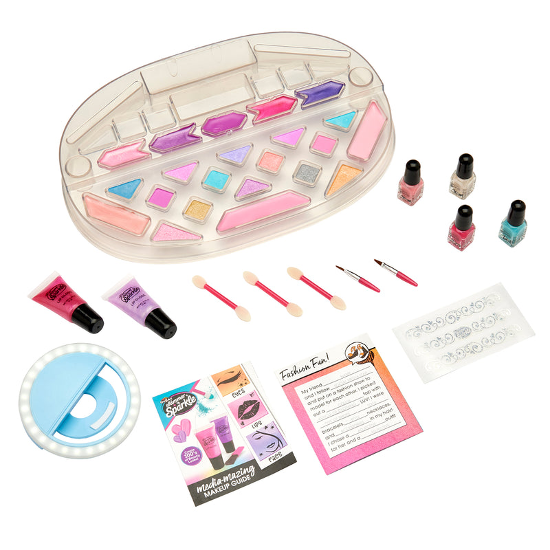 A Shimmer 'n Sparkle Light Up Beauty Studio featuring eyeshadow palette, nail polish, lip glosses, brushes, a ring light, application guides, and stencils.