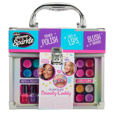 Shimmer 'n Sparkle All In One Make Up Caddy for kids with makeup and nail accessories, including eye shadows, lip tints, nail polish, and brushes. The packaging is colorful and contains images showing product usage.