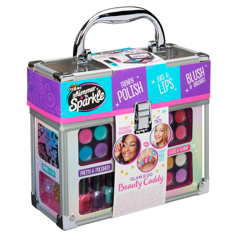 A clear plastic and metal makeup case labeled "Shimmer 'n Sparkle All In One Make Up Caddy." It includes eyeshadow, blush, nail polish, and lip glosses, and features images of young girls modeling the makeup.