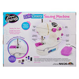 Box for a “Shimmer 'N Sparkle Sew Crazy Sewing Machine: Safe Starter Tool for Young Fashionistas!” with various accessories. The image includes annotated features like a protective needle cover and a foot pedal, and mentions it is for creating fashions and accessories.