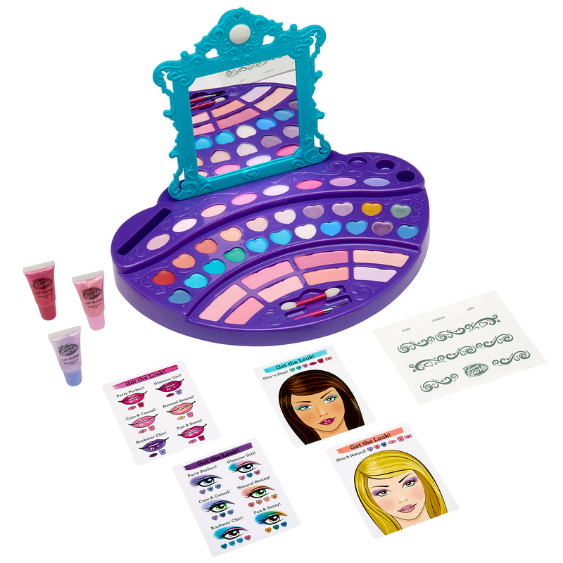A Cra-Z-Art Shimmer 'n Sparkle Real Ultimate Make Up Designer featuring a mirror, various cosmetic powders in a purple and blue palette, two tubes of gloss, design sheets for face painting, and illustrated guides.
