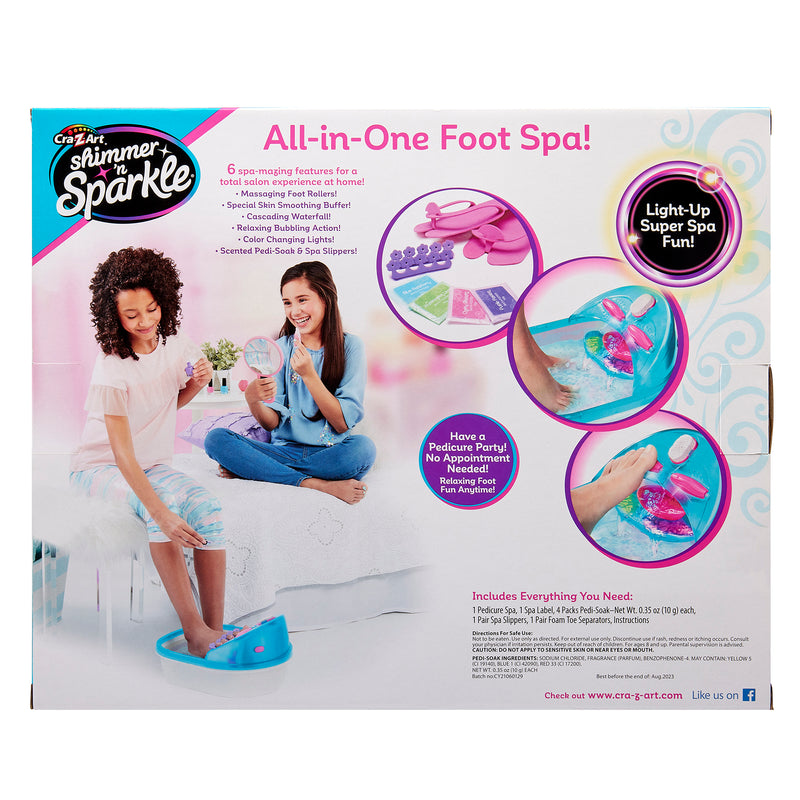 The image shows the packaging for a "Shimmer 'n Sparkle 6 in 1 Massaging Foot Spa" with images demonstrating the product's use. Features include a light-up function, relaxing massage, and various spa accessories.