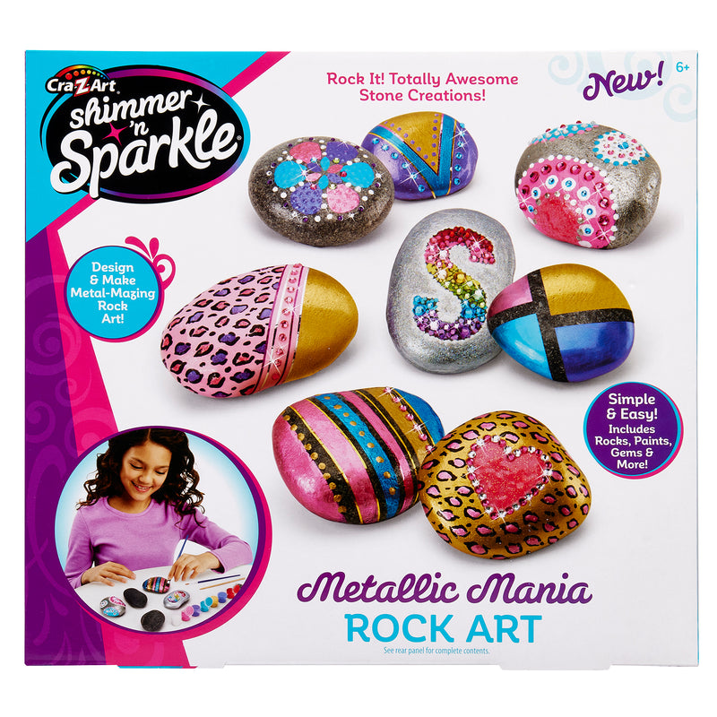 Image of a Cra-Z-Art Shimmer 'n Sparkle Metallic Mania Rock Art set. The box contains colorful painted stones and shows a girl painting rocks. Features include design tools and various art supplies.