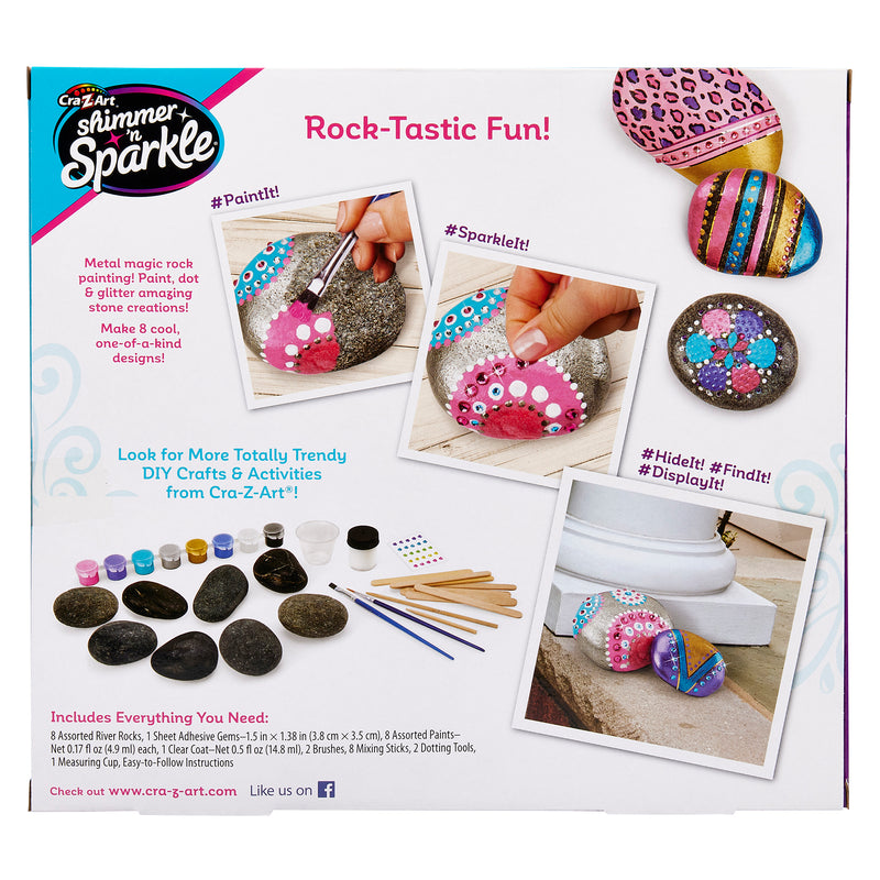 A Cra-Z-Art Shimmer 'n Sparkle Metallic Mania Rock Art kit showing painted rocks, examples of crafted designs, and included supplies like paintbrushes, paints, and rocks.