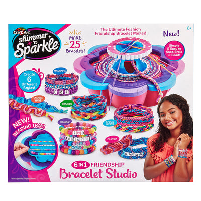 Box cover of a Shimmer 'n Sparkle 6 in 1 Friendship Bracelet Studio showing a girl wearing several colorful bracelets, and the bracelet making tool. The text highlights its ability to create 25 bracelets with 6 different styles.
