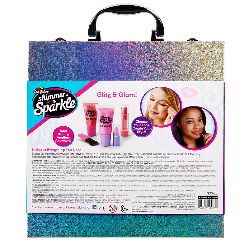 Shimmer 'n Sparkle Glitter Case includes lip gloss, eyeshadow, nail polish, blush, and accessories. The packaging features images of the products and instructions, with a holographic front cover and handle.