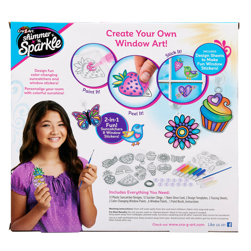A product box for "Shimmer 'n Sparkle Color Change Window Art" showing a girl, design examples, tools, and instructions to paint, peel, and stick sun catchers and window stickers.