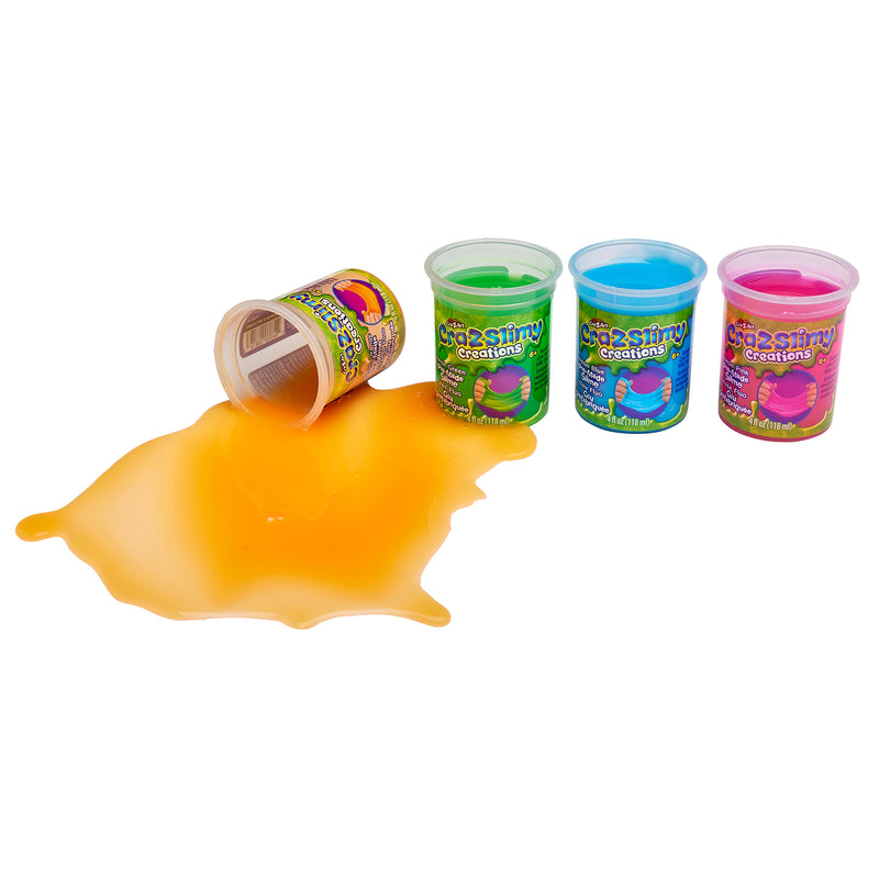 Four containers of colorful slime, labeled "Cra-Z-Slimy Single Cans 4 OZ: Colorful, Stretchy Sensory Delight for Everyday Play!," with one orange slime container toppled over, spilling its contents.