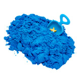 A pile of Cra-Z Sand Blue Blast 3lb Bag with a plastic scoop partially buried in the sand, containing a yellow star shape.