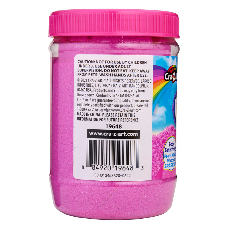 A jar of Cra-Z-Sand Pink Glitter Sand, 1.5 LB Tub with a label providing usage warnings, manufacturer information, and a barcode.