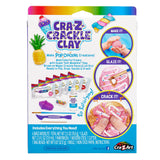 Package of Cra-Z Crackle Clay showing various tools and materials inside. Text reads "Make it! Glaze it! Crack it!" and "Includes Everything You Need!" with an illustration demonstrating the activities.