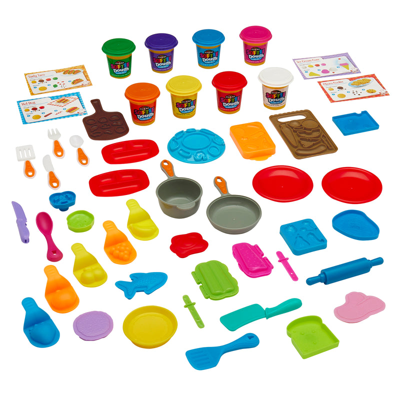 A collection of Softee Dough Super Chef Set tubs and various colorful plastic utensils, molds, and accessories used for crafting and playing.