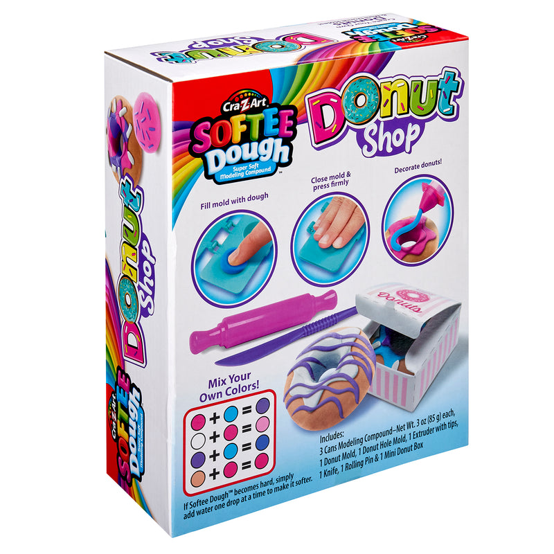 Image of Softee Dough Donut Shop Medium box. The packaging showcases tools and steps to mold and decorate play dough donuts, including a rolling pin, press, and decorating accessories.