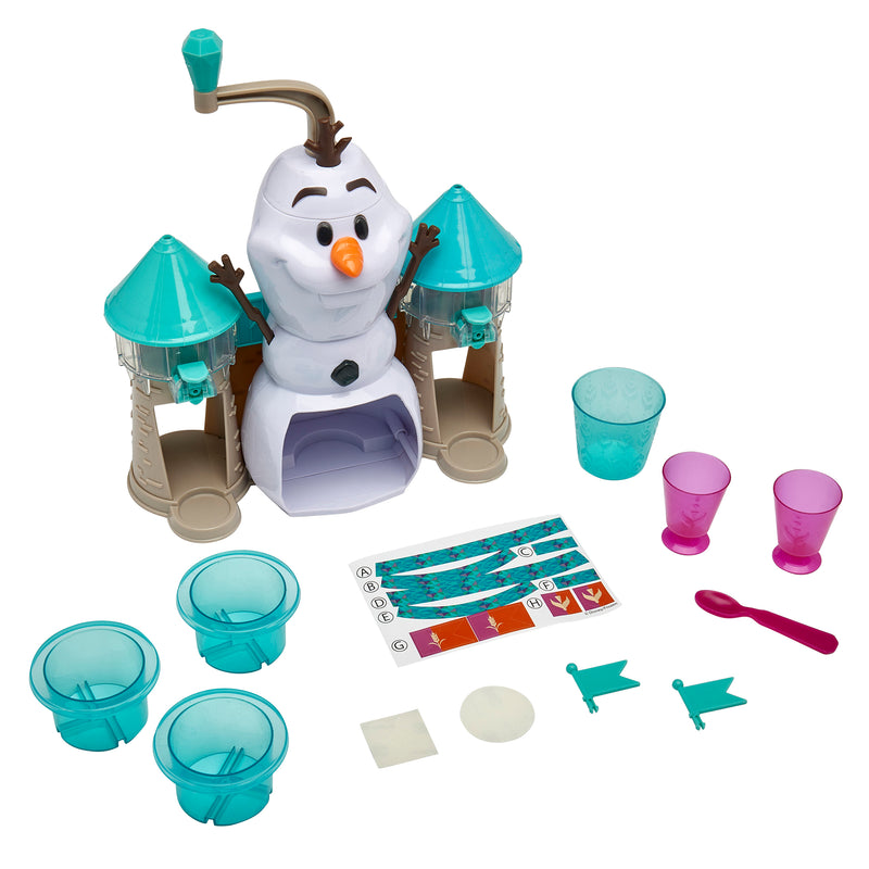 Disney Frozen 2 Slushy Treat Maker featuring a snowman figure on top of a castle-like structure, four teal cups, two pink cups, a teal spoon, flags, and stickers.