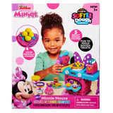 Box for Disney Minnie Softee Dough Color Change Kitchen for ages 3+, featuring a smiling child playing with included colorful dough and accessories. Contains choking hazard warning.