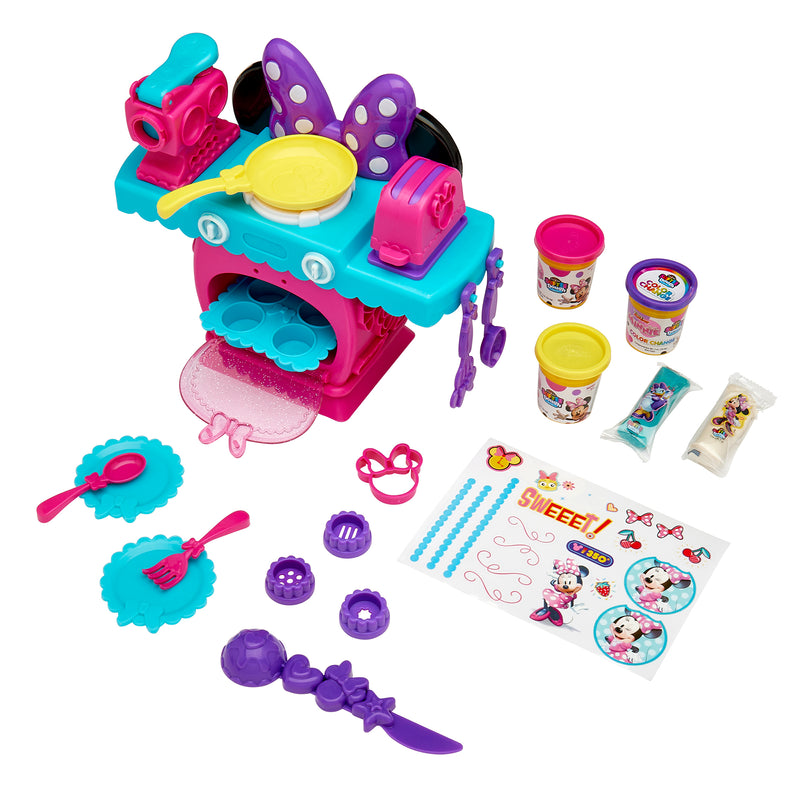A Disney Minnie Softee Dough Color Change Kitchen with playdough, utensils, a stove, and decorating accessories based on a mouse character theme.