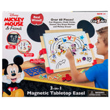 A Disney Junior Mickey & Friend: 3 in 1 Magnetic Tabletop Easel. Includes over 60 pieces like chalk sticks, markers, and an eraser. Suitable for children aged 3 and up. Box shows a child using the board.