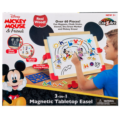 A Disney Junior Mickey & Friend: 3 in 1 Magnetic Tabletop Easel. Includes over 60 pieces like chalk sticks, markers, and an eraser. Suitable for children aged 3 and up. Box shows a child using the board.