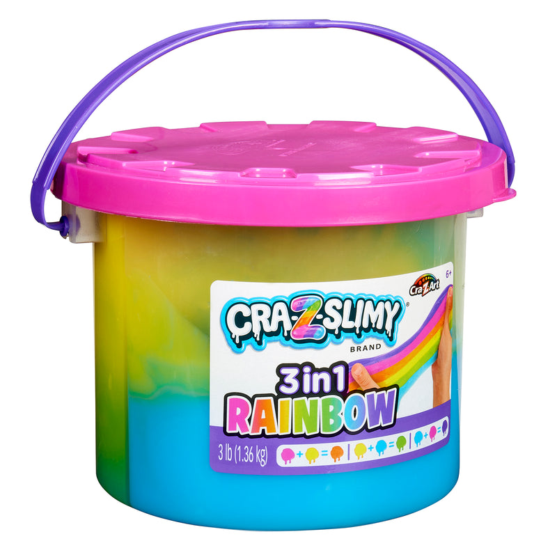 Image of a tub of Cra-Z-Slimy Bucket TRICOLOR RAINBOW 48 OZ, featuring a pink lid and multi-colored slime inside. The tub has a blue handle and contains 3 pounds (1.36 kg) of slime.