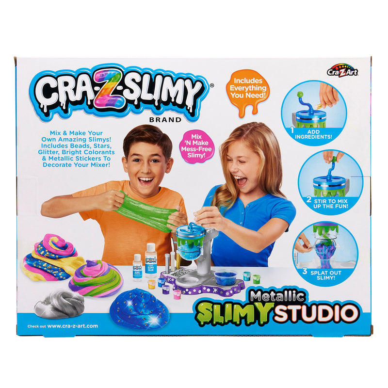 The image shows a Cra-Z-Slimy Metallic Slimy Studio kit, featuring children making slime with various ingredients, and colorful slime examples, packaged in a colorful box.
