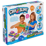 Box of Cra-Z-Slimy Metallic Slimy Studio, showing children playing with colorful slime. Box includes images of slime colors, accessories, and instructions.
