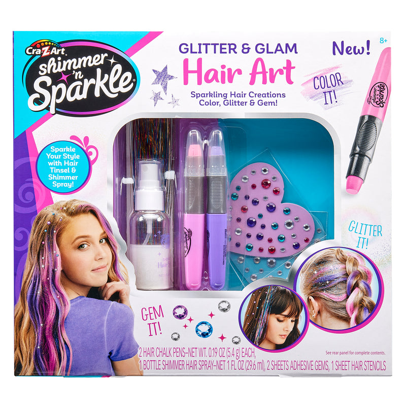 A kids' hair art kit titled "Shimmer 'n Sparkle Shimmering Metallic Hair Art" with items for coloring and decorating hair, including chalk pens, spray, stencils, and gems. Pictured on the box are examples of its use.