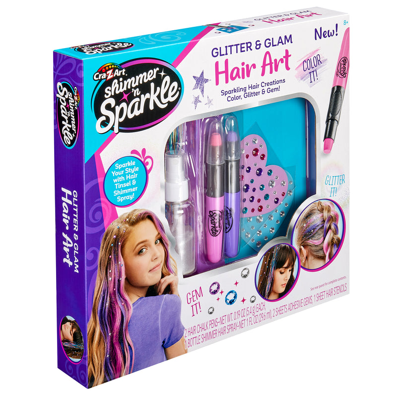 Box of Shimmer 'n Sparkle Shimmering Metallic Hair Art with various hair styling tools and accessories including hair chalks, glitter, gems, and spray bottles. Packaging shows decorated hair.