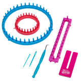 The Shimmer 'n Sparkle 3 in 1 Ultimate Knitting Station containing two round looms, one rectangular loom, two plastic needles, a hook tool, and a pink separator card.