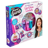Box of Shimmer 'n Sparkle Glitter & Gem Lip Gloss Lockets featuring three lip gloss tubes, charms, and lockets. The box shows a girl blowing a kiss and showcases the products inside.