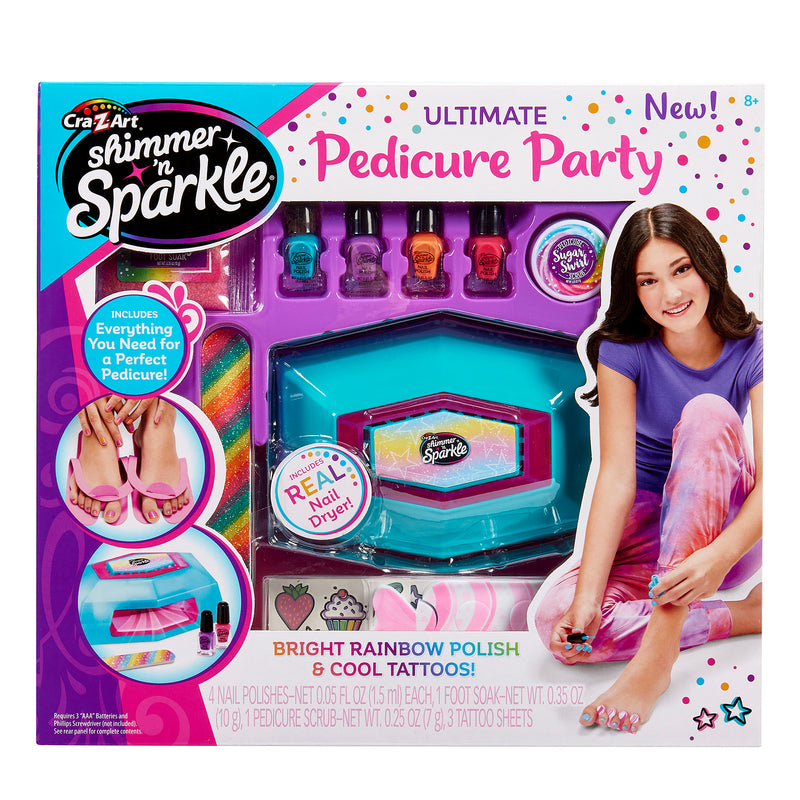 The image shows a box of Shimmer 'n Sparkle Ultimate Pedicure Party featuring colorful nail polishes, a nail dryer, and other pedicure tools. A girl is shown enjoying the pedicure on the box.