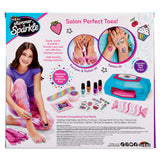 Image of a toy set called "Shimmer 'n Sparkle Ultimate Pedicure Party" featuring a girl painting her toenails. The set includes nail polish, stickers, a nail dryer, and other accessories for pedicures.