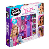 Package of "Shimmer 'n Sparkle BRAID & WRAP HAIR DESIGNER" kit, showing contents including hair accessories, styling tool, and instructions with photos of example hairstyles on the box.